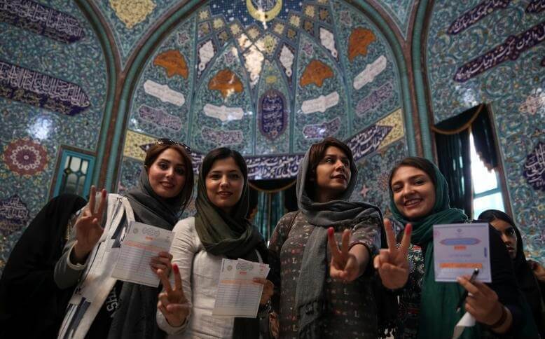 Iranian women show their ink-stained fingers after casting their votes during the presidential election in Tehran, Iran, May 19, 2017. TIMA via REUTERS